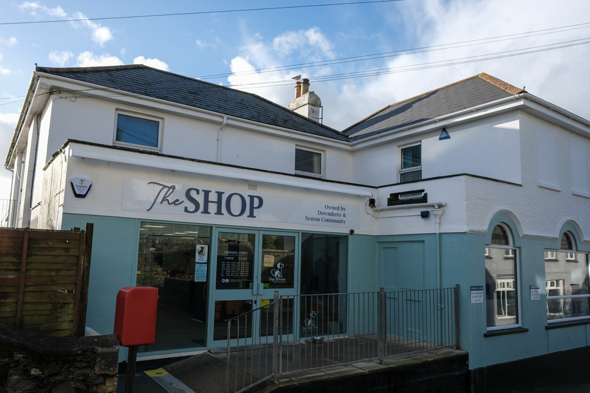 The Shop exterior showing the storefront with blue-grey trim